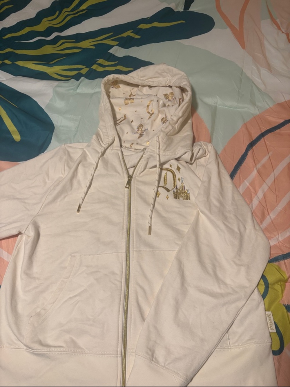 Disneyland 70th birthday Cream Zip Hoodie with Gold Castle Accents.